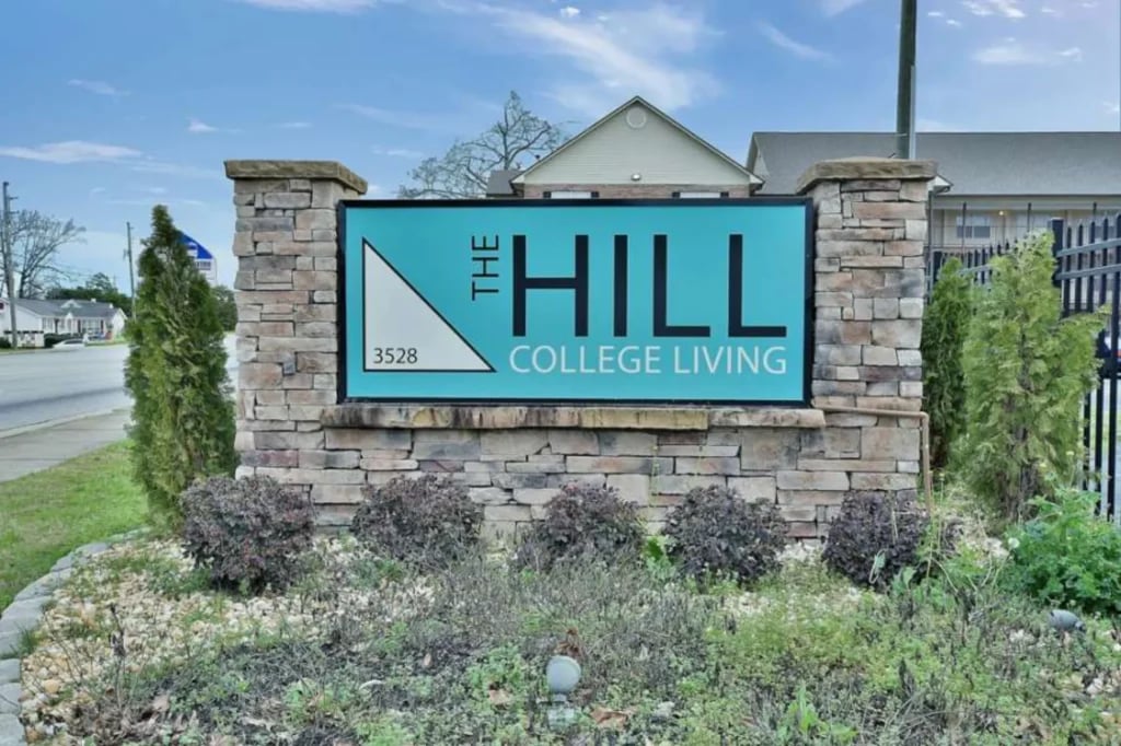The Hill College Living sign exterior at The Hill Apartments - Student Living in Columbus Student Accommodation