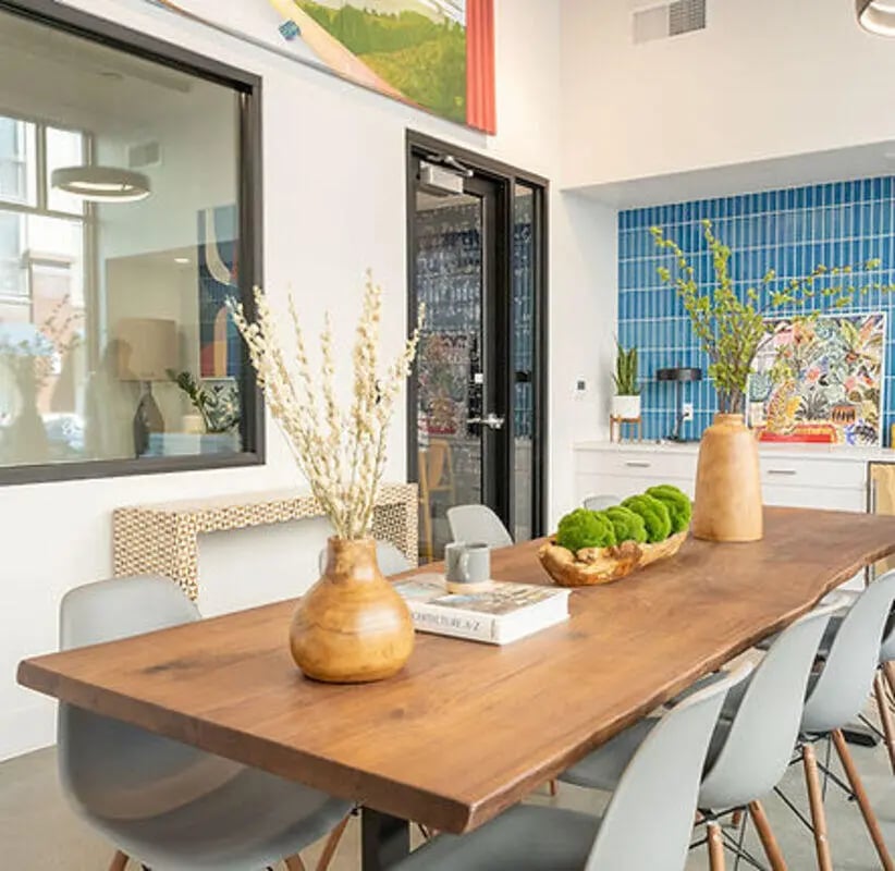 Dining table with chairs and decor common area at Aquatic at U in Berkeley Student Accommodation