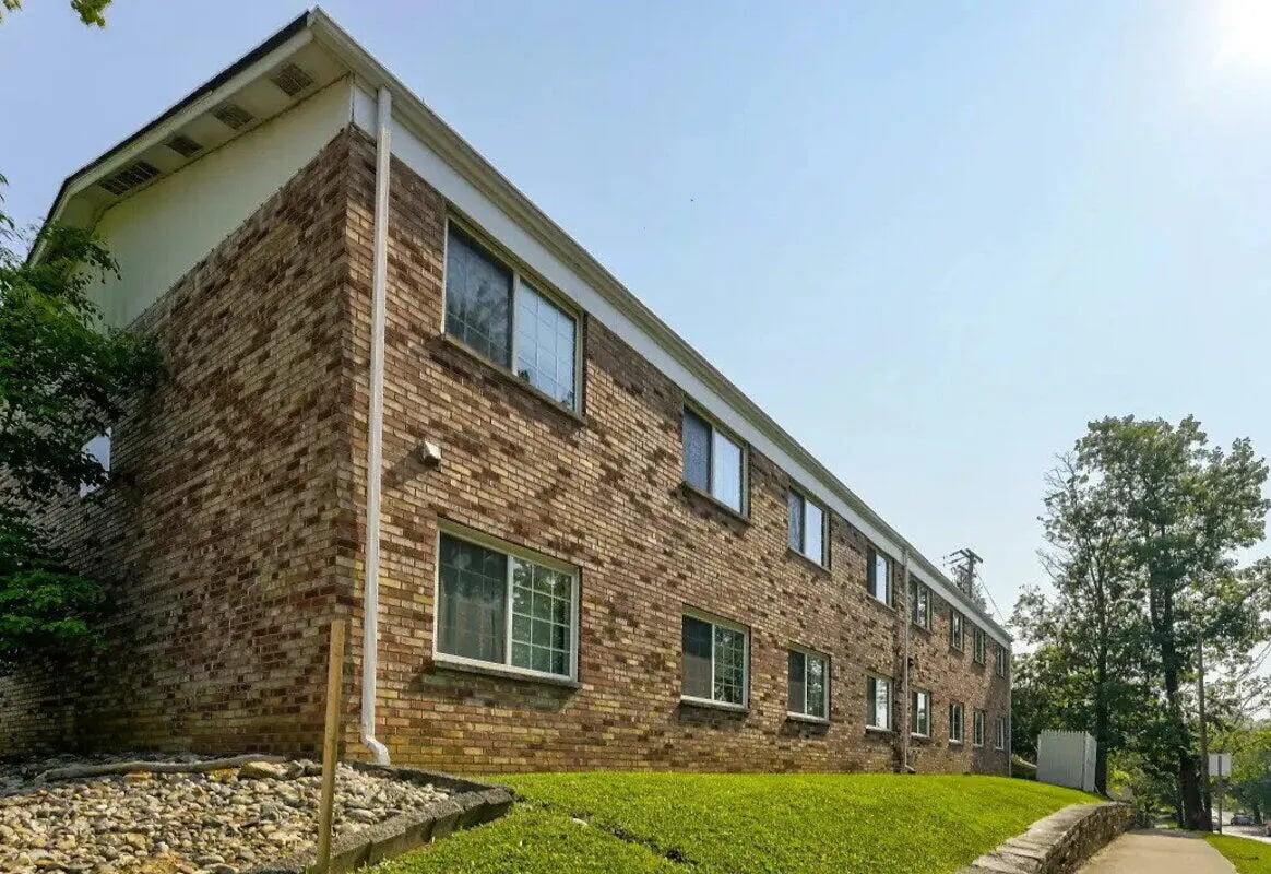 Brick building with many windows exterior at Campus Walk South in Bloomington Student Accommodation