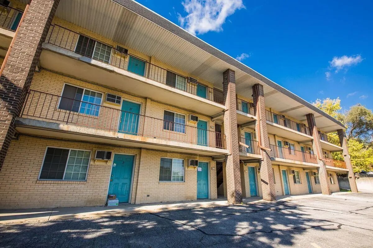 Balconies and multiple doors on brick building Exterior at Crestview II+ in West Lafayette Student Accommodation