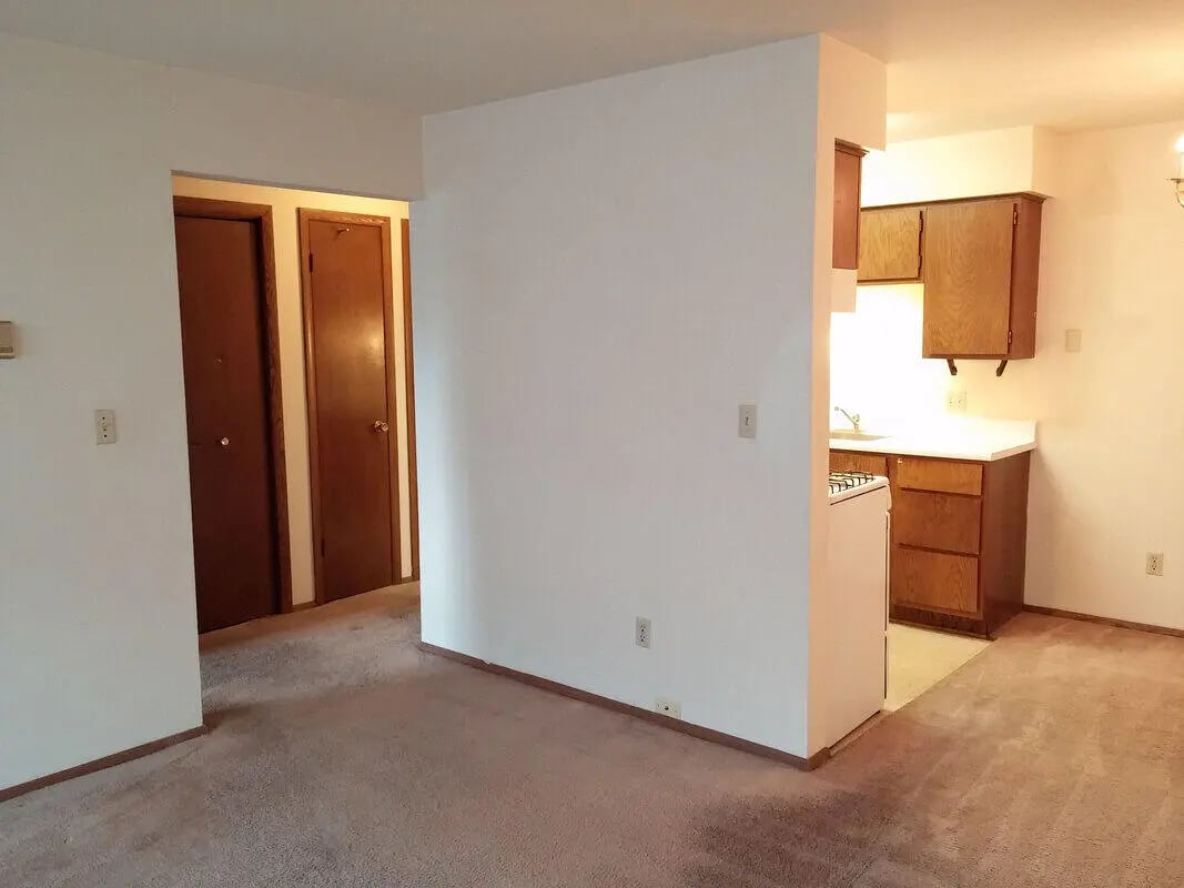 Two doors and kitchen area interior at Campus Court in Milwaukee Student Accommodation