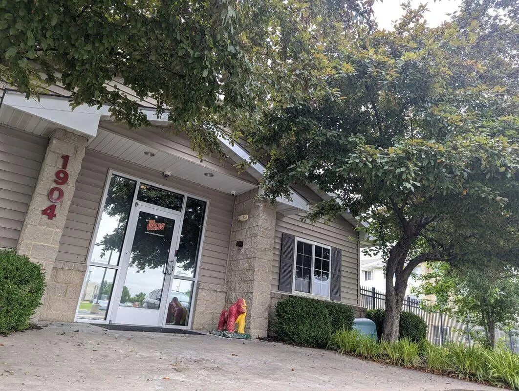 Building entrance with 1904 address and gorilla sculpture exterior at Crimson Villas in Pittsburg Student Accommodation