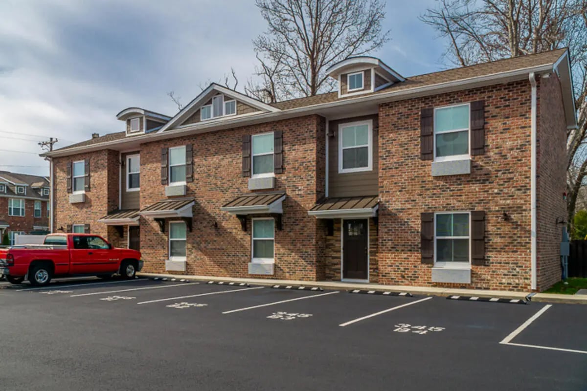 Brick buildings with red truck exterior at Eagle Summit Apartments in Cookeville Student Accommodation