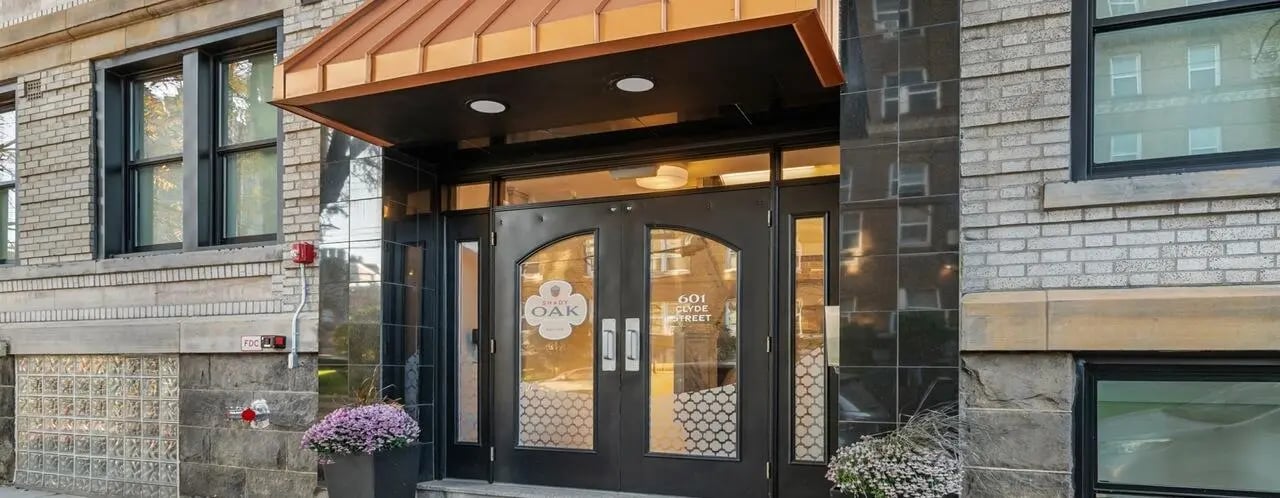 Double doors with address flowers building exterior at Clyde Street Apartments in Pittsburgh Student Accommodation