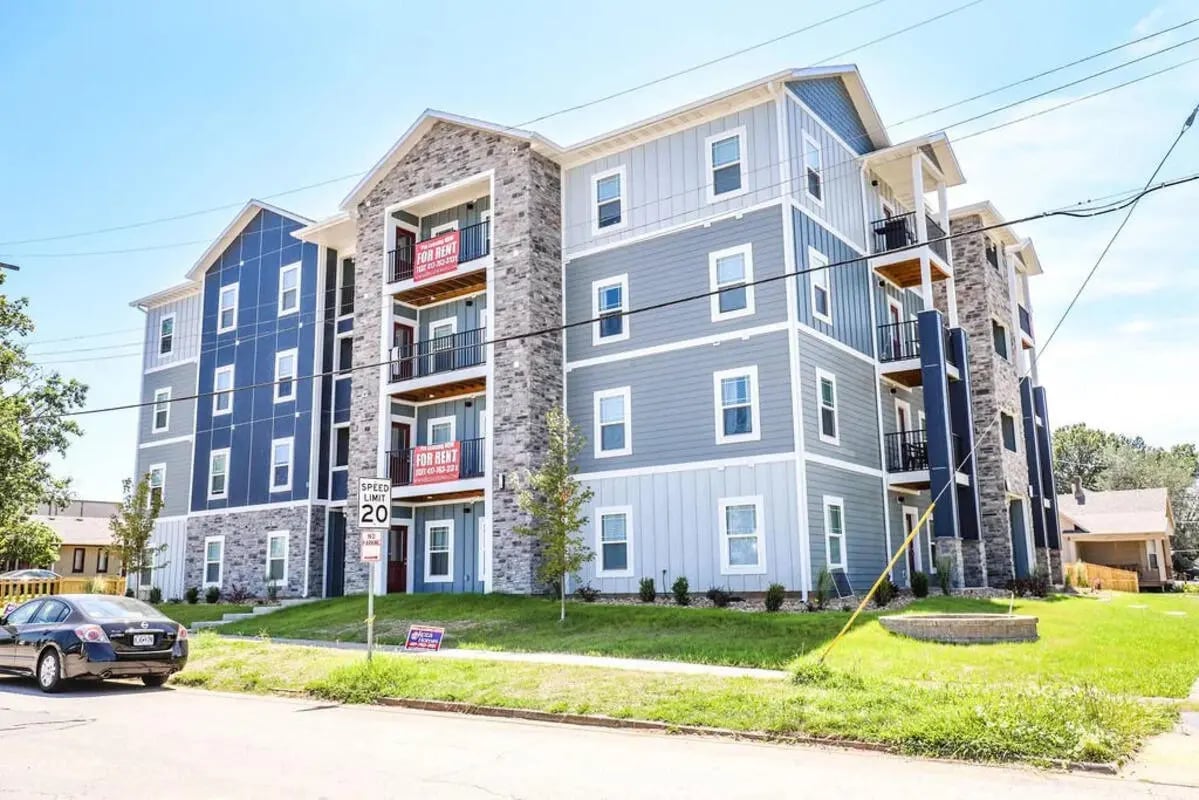 Apartment building with for rent signs exterior at Bears Tower- Newest Residential Units Next to MSU Campus in Springfield Student Accommodation
