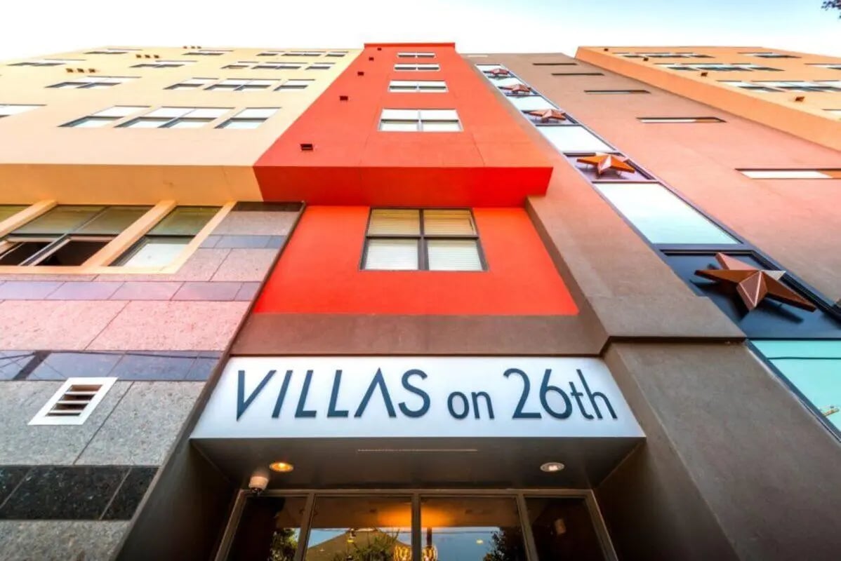 Villas on 26th building exterior with windows and stars at Villas on 26th in Austin Student Accommodation