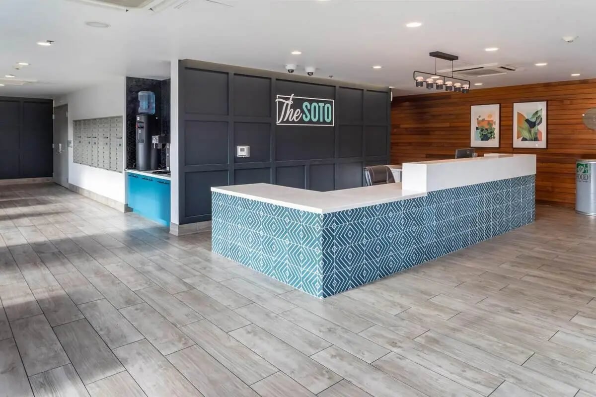 Reception desk with mailboxes and water cooler lobby at The Soto in Eugene Student Accommodation