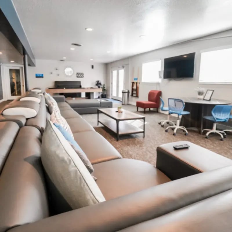 Large sectional sofa coffee table study area living room at Campus Edge Milledgeville in Milledgeville Student Accommodation