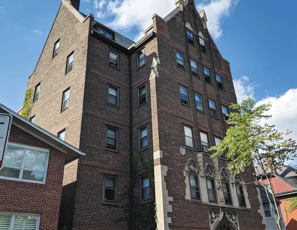 Brick building with windows and trees exterior at 5748 Blackstone by 3L Living in Chicago Student Accommodation