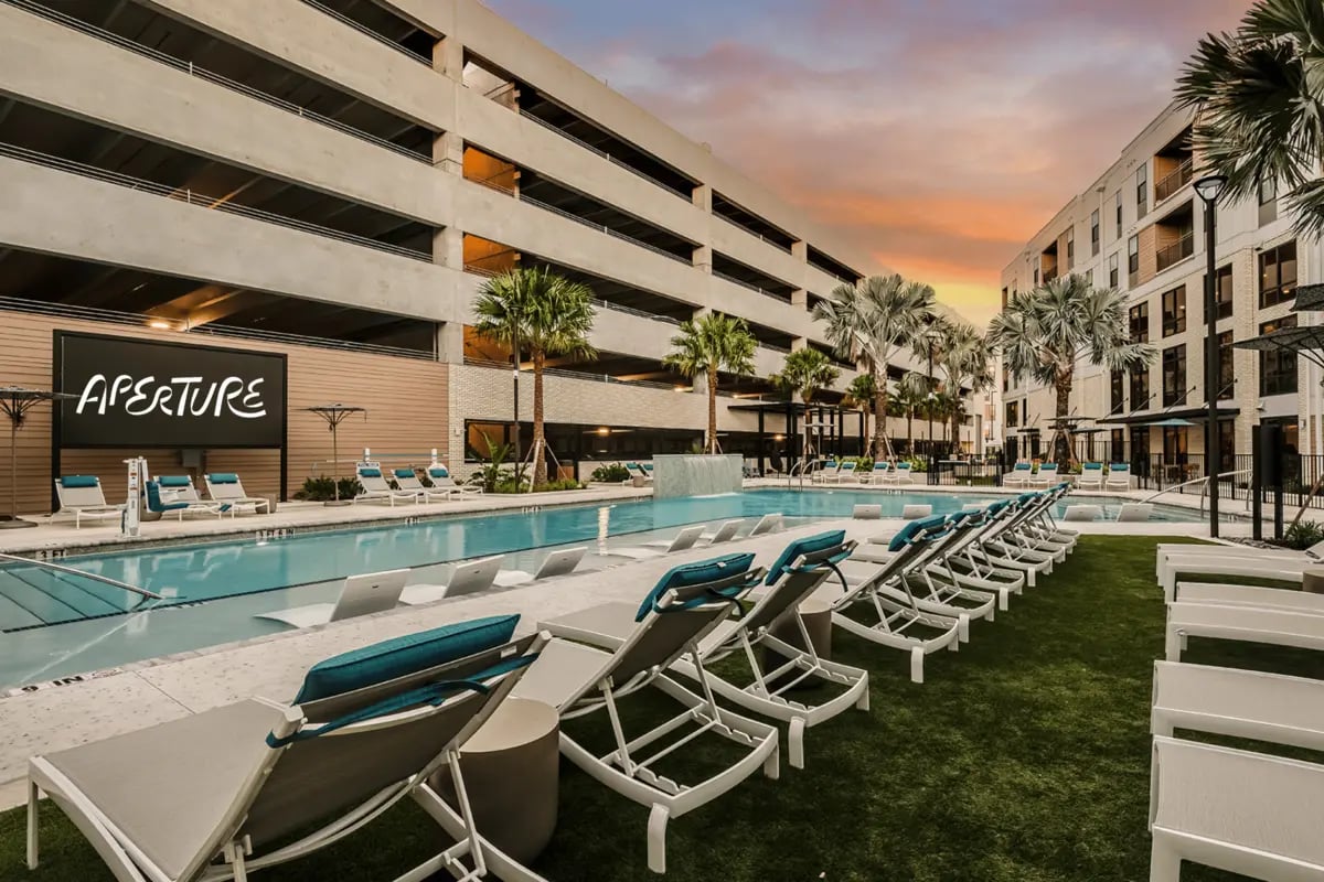 Pool loungers by swimming pool exterior at Aperture in Orlando Student Accommodation