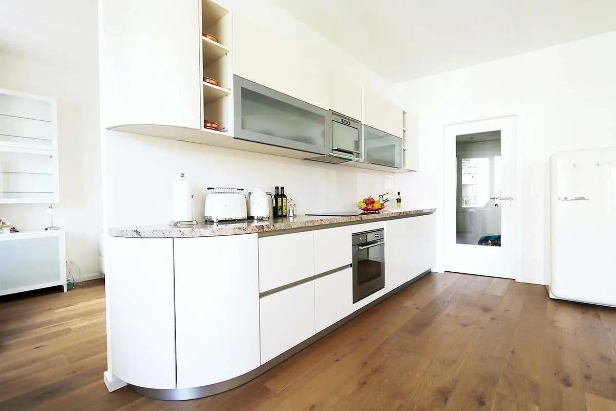 Modern white kitchen with oven and refrigerator kitchen at Apartment in Von-der-Heydt-Straße 1, 10785 Berlin, Germany in Berlin Student Accommodation