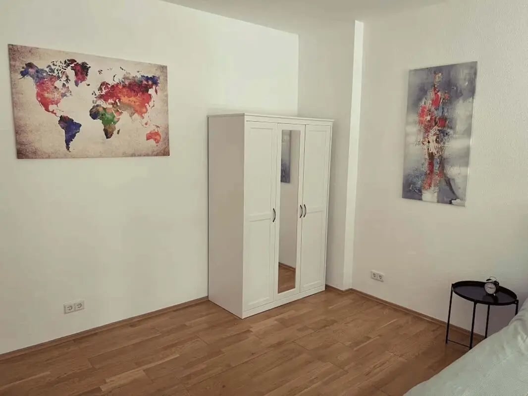 White wardrobe world map abstract art bedroom at Apartment in Simplonstraße, 10245 Berlin-Bezirk Friedrichshain-Kreuzberg, Germany in Berlin Student Accommodation