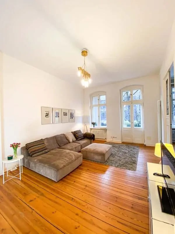 Lounge with sofa ottoman rug living room at Apartment in Karlsruher Str. 11, 10711 Berlin, Deutschland in Berlin Student Accommodation