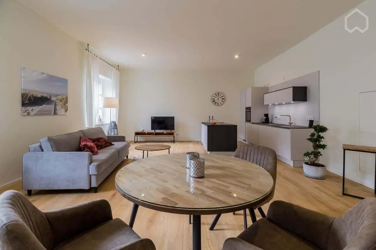 Sofa kitchen island dining table living room kitchen at Apartment in Geisbergstraße 8, 10777 Berlin, Deutschland in Berlin Student Accommodation