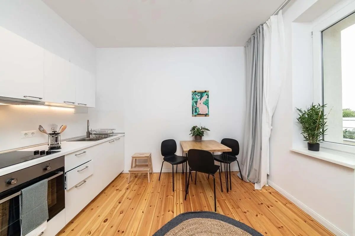 Kitchen with table chairs and oven kitchen at Apartment in Seumestraße, 10245 Berlin-Bezirk Friedrichshain-Kreuzberg, Germany in Berlin Student Accommodation