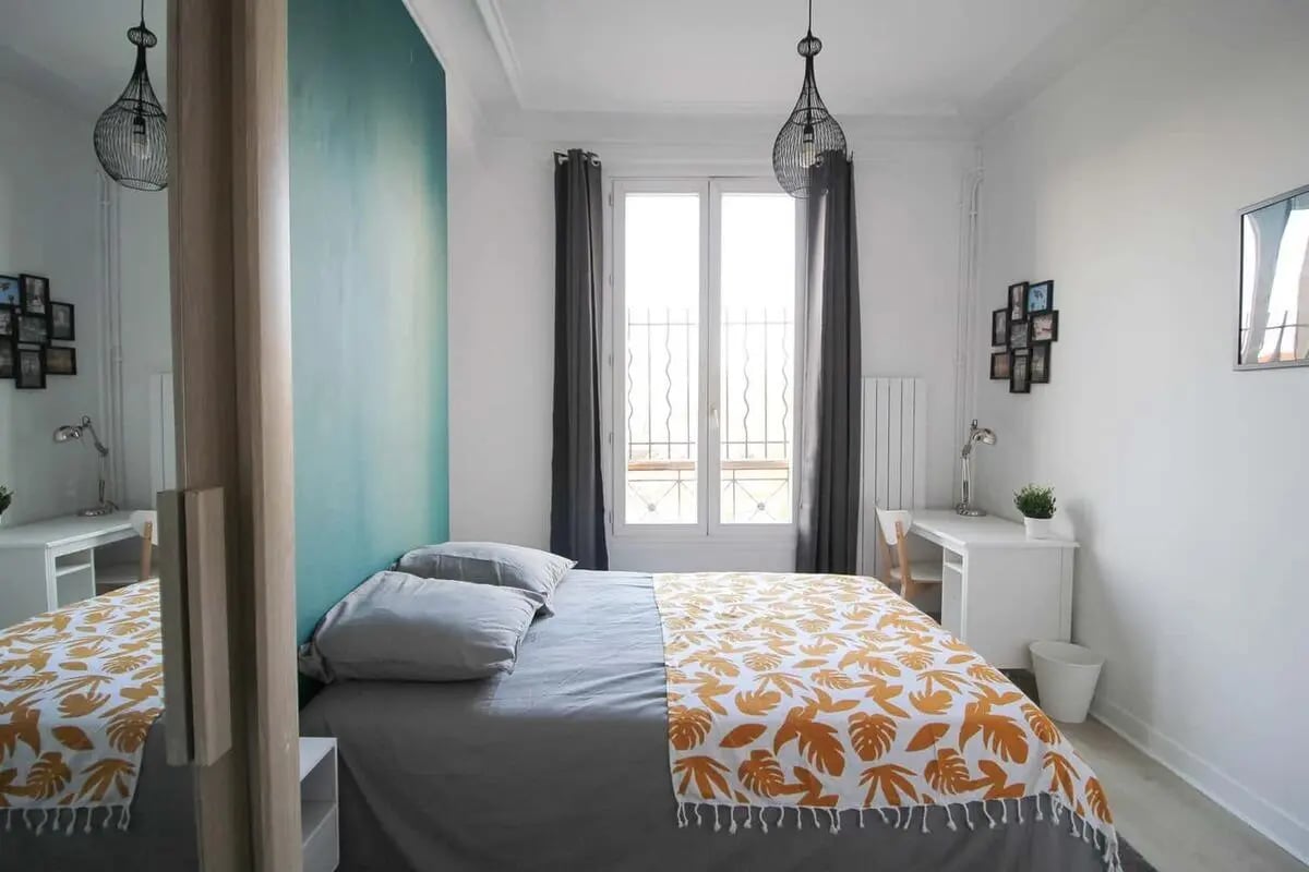 Bed pillows desk and lamp bedroom at Room in 207 Rue du Faubourg Saint-Denis, 75010 Paris, France in Paris Student Accommodation