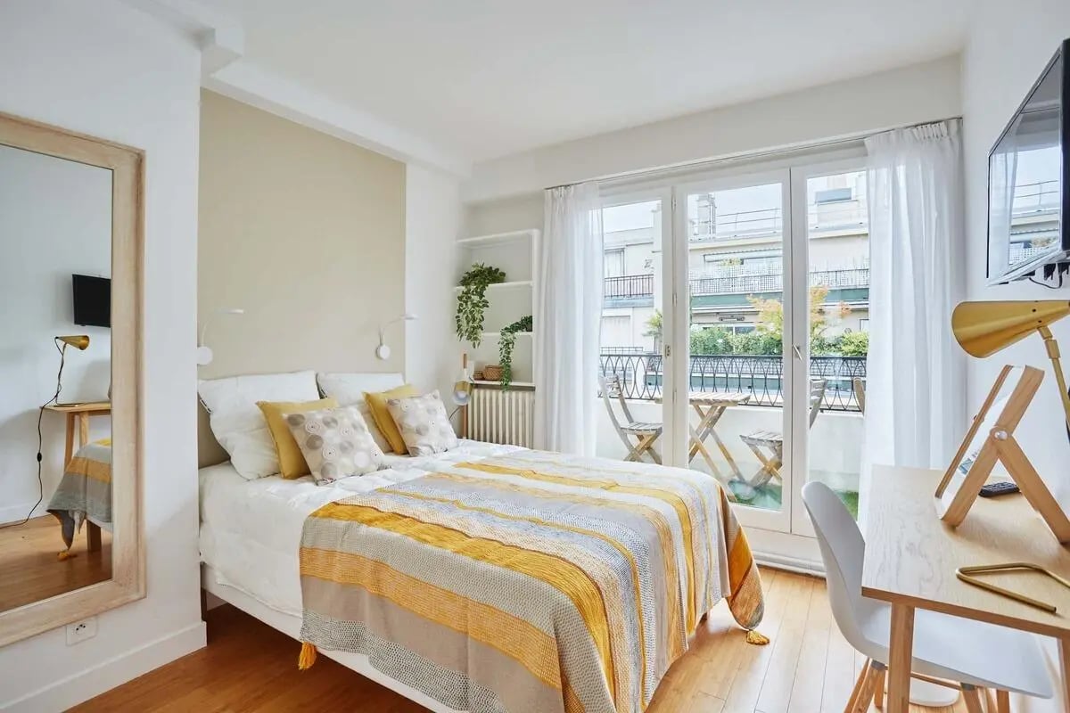 Bed desk mirror and balcony bedroom at Apartment in Rue Degas, 75016 Paris, France in Paris Student Accommodation