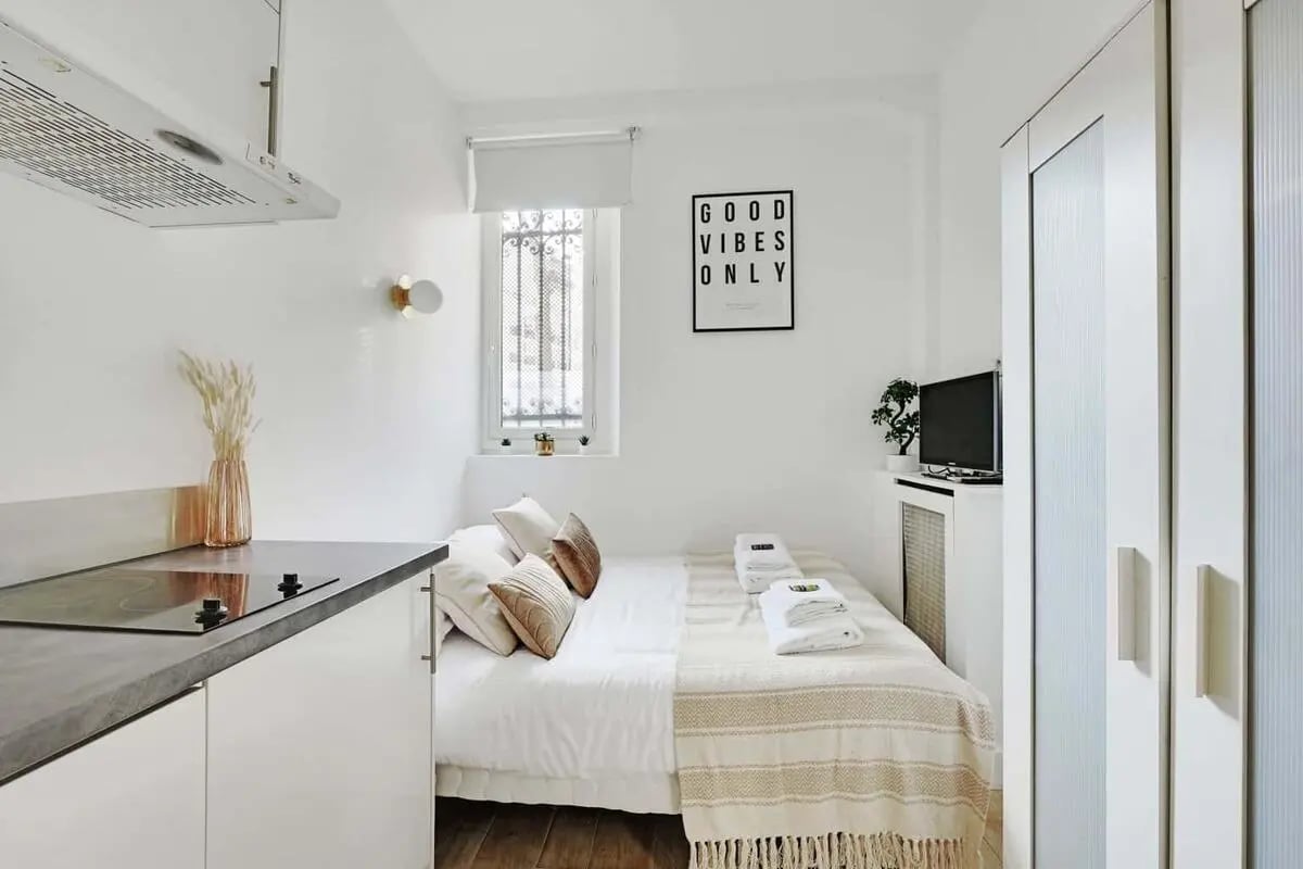 Kitchenette with induction hob and bed area bedroom at Studio in 53 Av. Duquesne, 75007 Paris, France in Paris Student Accommodation