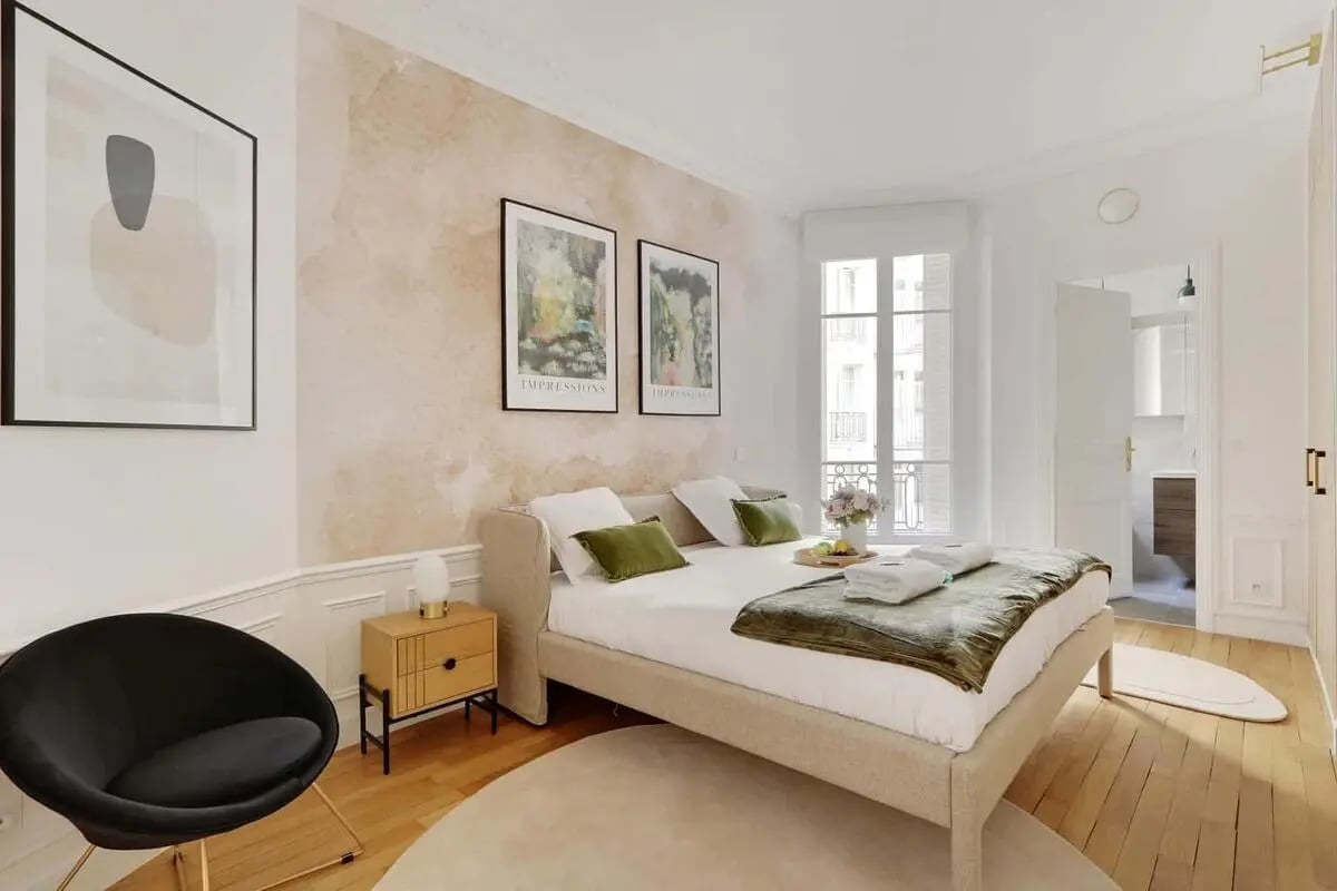 Bed with pillows and art bedroom at Apartment in 21 Av. de Suffren, 75007 Paris, France in Paris Student Accommodation