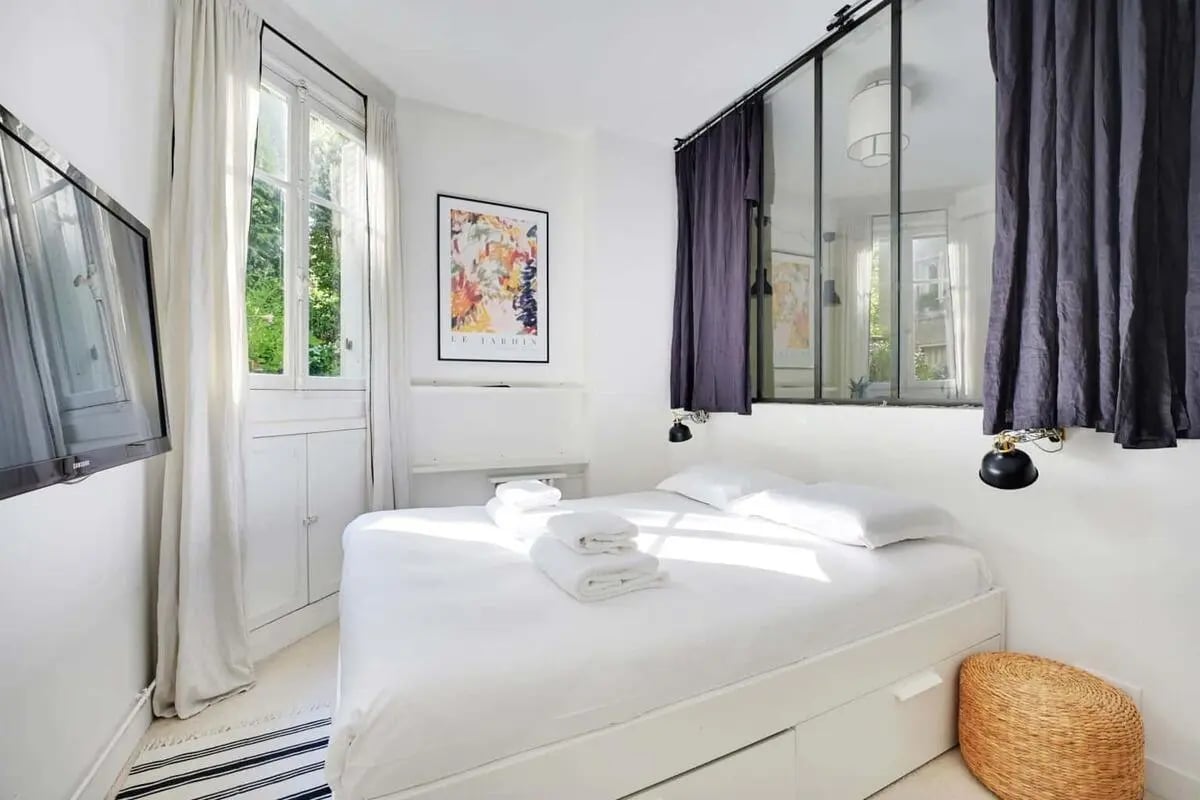 White bed towels artwork and basket bedroom at Apartment in 72 Av. de Versailles, 75016 Paris, France in Paris Student Accommodation
