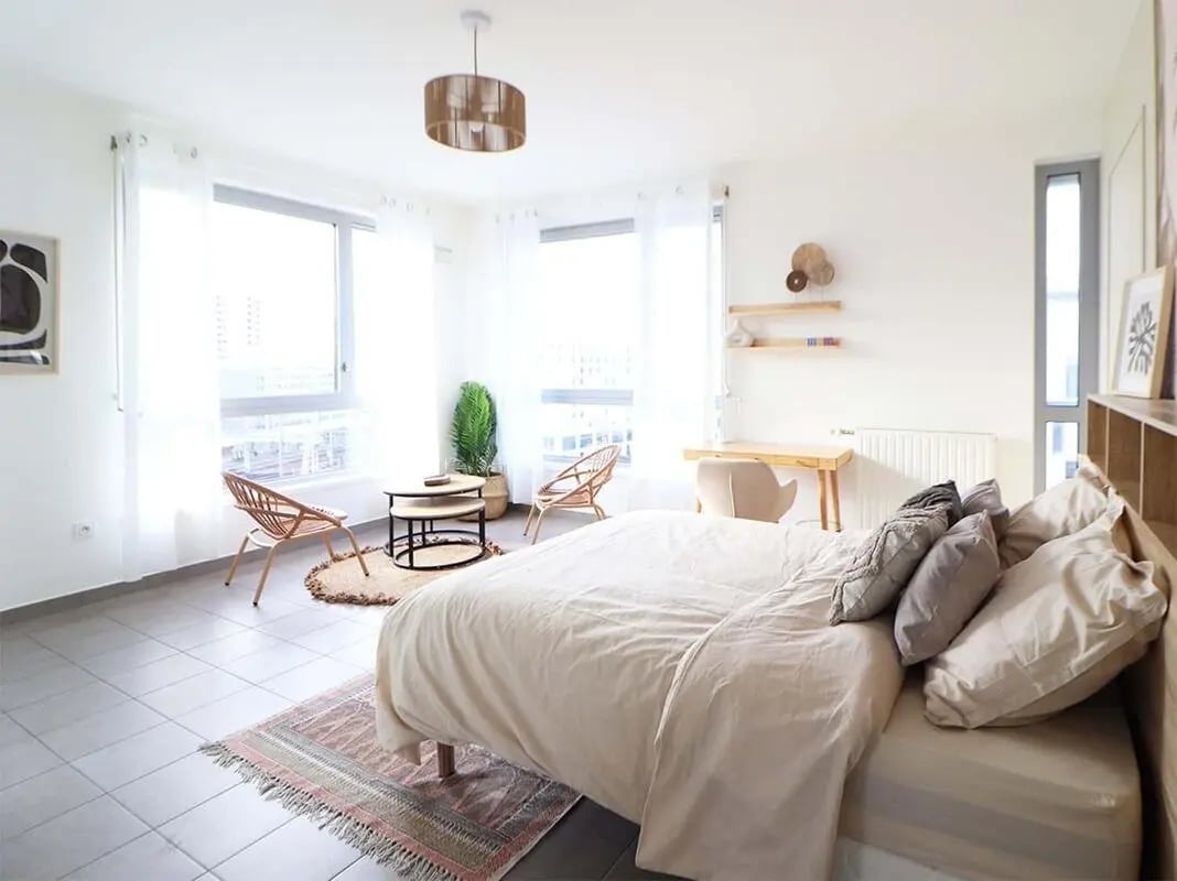 Bed desk chairs and plant living room at Room in 54 Rue Cesária Évora, 75019 Paris, France in Paris Student Accommodation