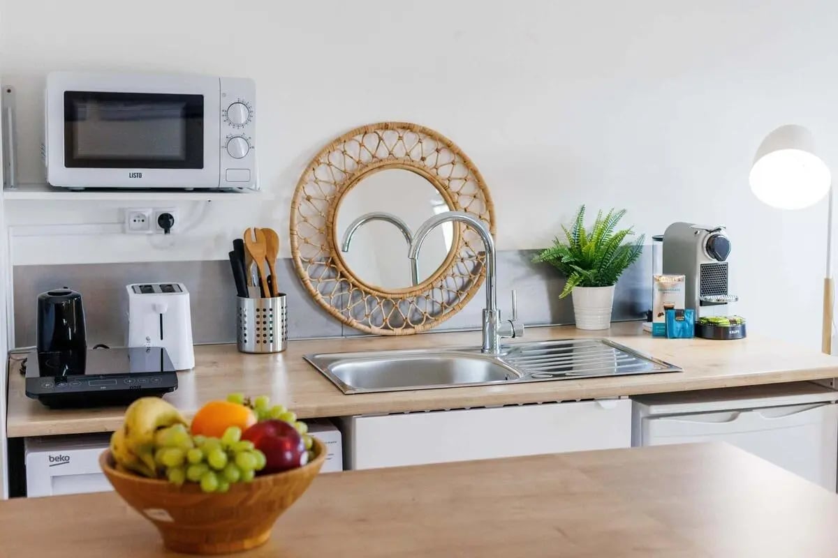 Microwave toaster fruit bowl mirror kitchen at Studio in 2 Rue de Châteaudun, 75009 Paris, France in Paris Student Accommodation
