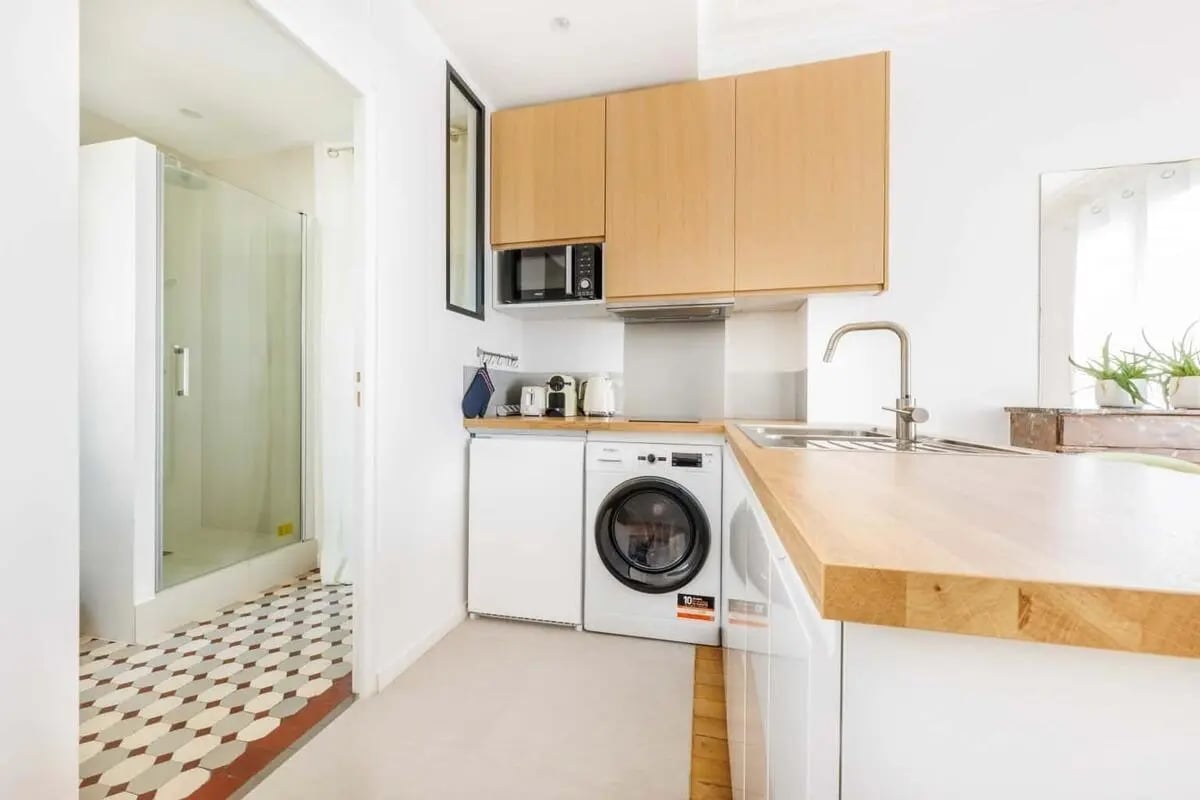 Shower washing machine sink cabinets and countertop kitchen at Apartment in 144 Rue de Tolbiac, 75013 Paris, France in Paris Student Accommodation