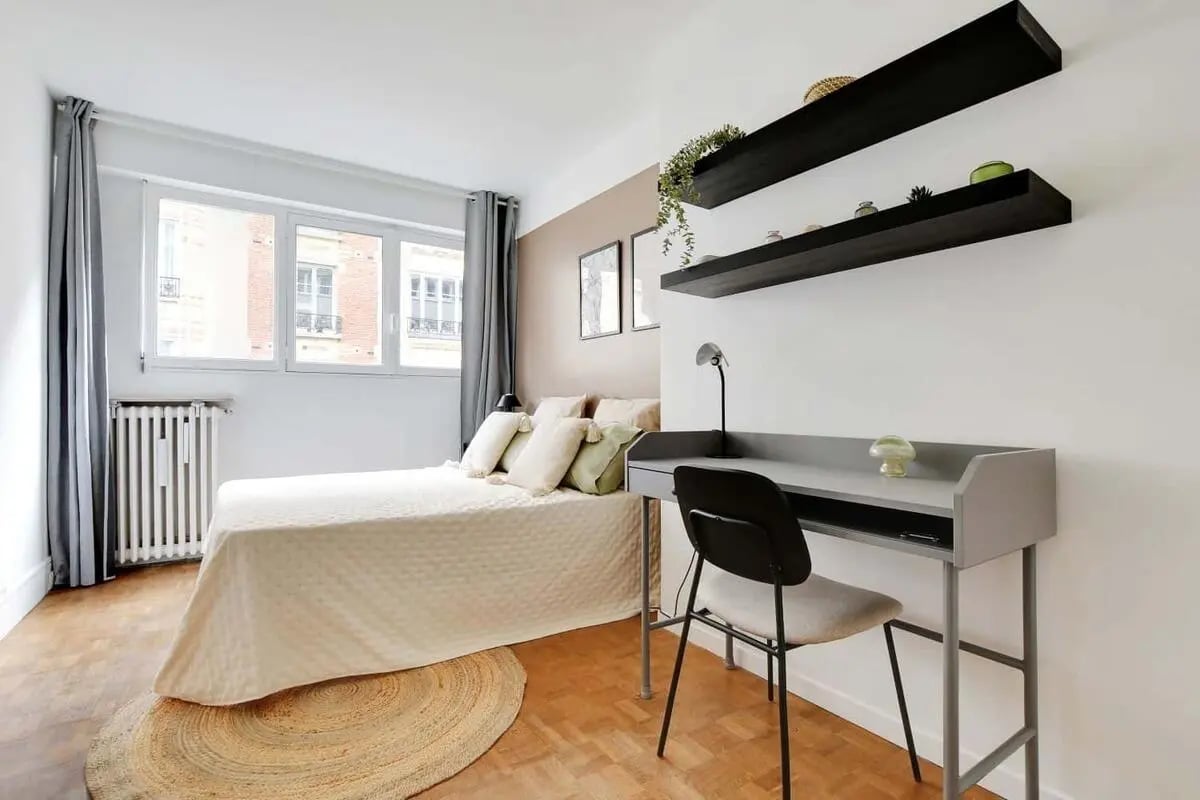 Bed with pillows desk with chair shelves Bedroom at Room in 3 Rue Victor Duruy, 75015 Paris, France in Paris Student Accommodation