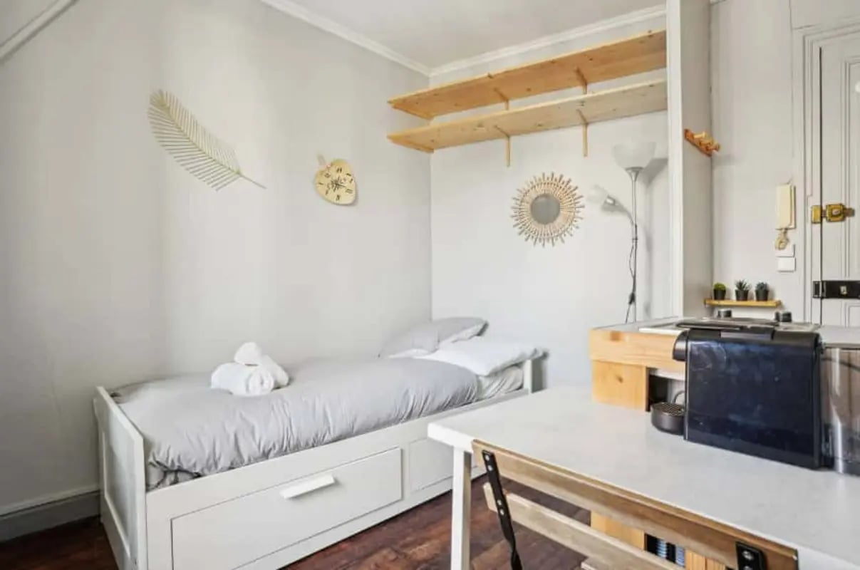 Bed with drawers desk coffee machine bedroom at Studio in 153 Rue Lamarck, 75018 Paris, France in Paris Student Accommodation