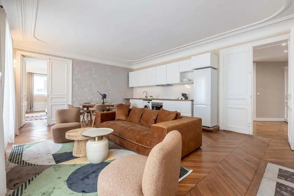 Sofa chairs coffee tables kitchen dining area living room at Apartment in 61 Rue de Rome 61, 75008 Paris, France in Paris Student Accommodation