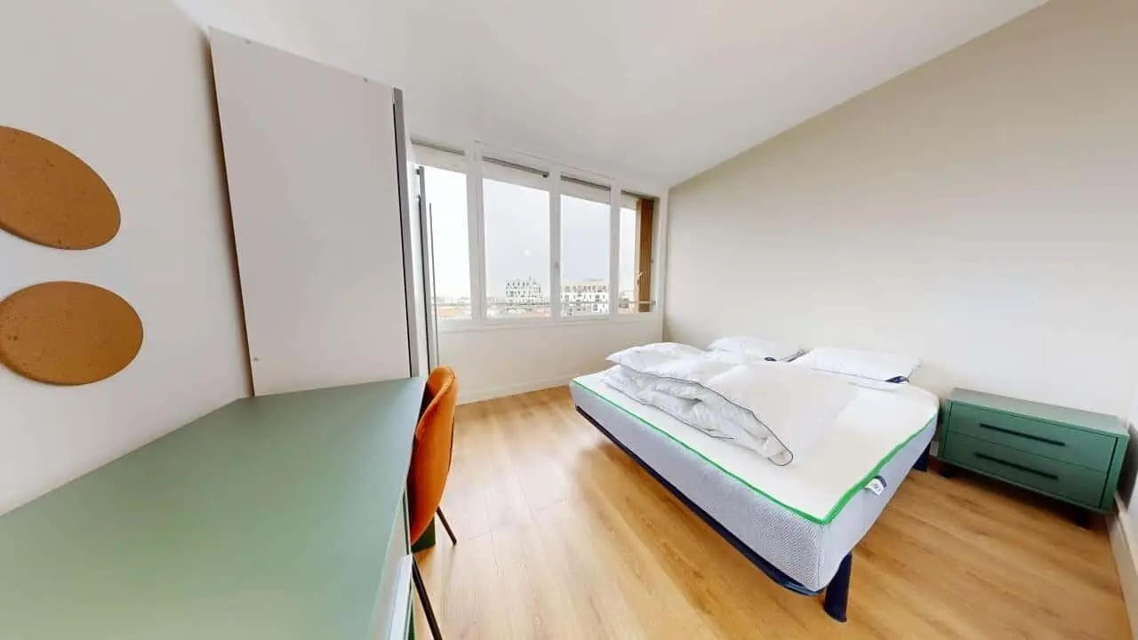 Desk chair bed dresser and windows bedroom at Room in 13 Av. du Colonel Fabien, 93500 Pantin, France in Pantin Student Accommodation