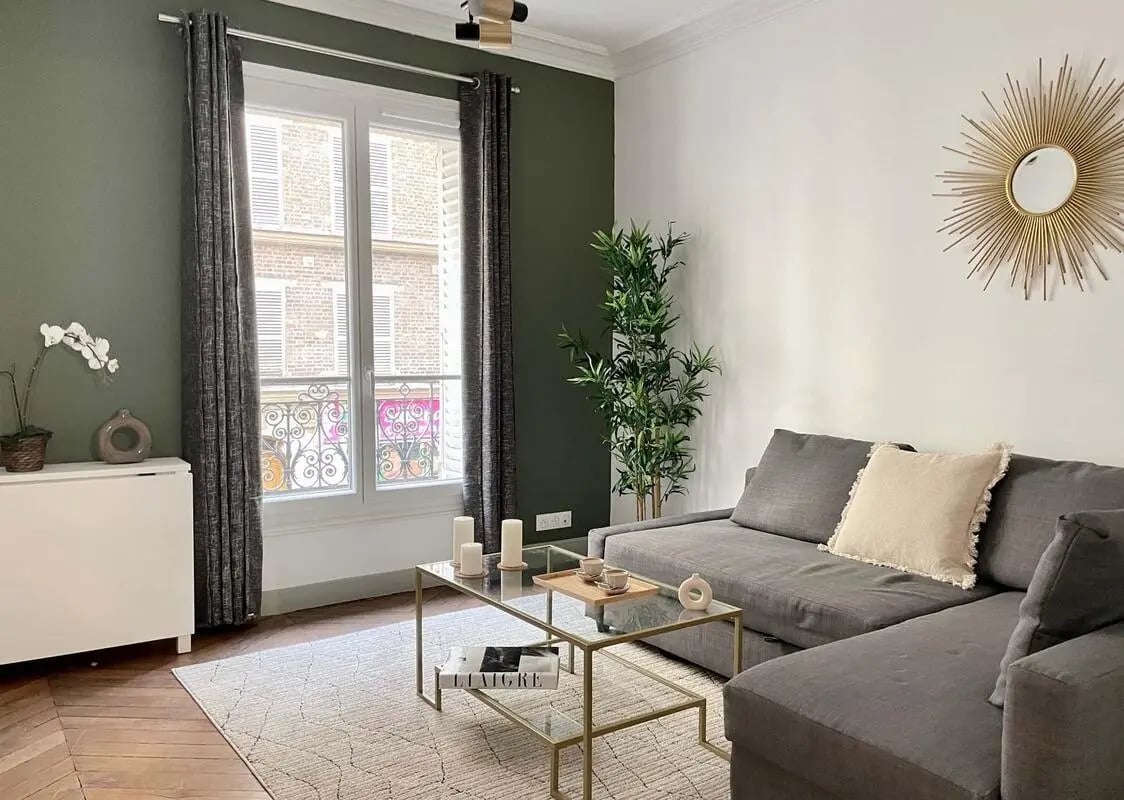 Sofa coffee table candles plant living room at Apartment in 180 Rue Legendre, 75017 Paris, France in Paris Student Accommodation