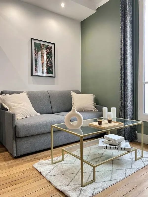 Sofa coffee table artwork rug living room at Apartment in 38 Rue de l'Abbé Groult, 75015 Paris, France in Paris Student Accommodation