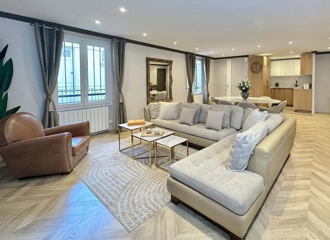 Sofa armchair coffee tables rug living room at Apartment in 42 Rue des Petits Champs, 75002 Paris, France in Paris Student Accommodation