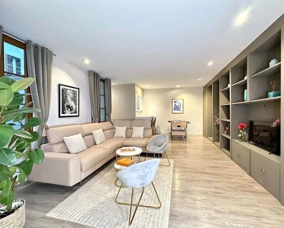 Sectional sofa two chairs and shelves living room at Apartment in 68 Rue du Bac, 75007 Paris, France in Paris Student Accommodation