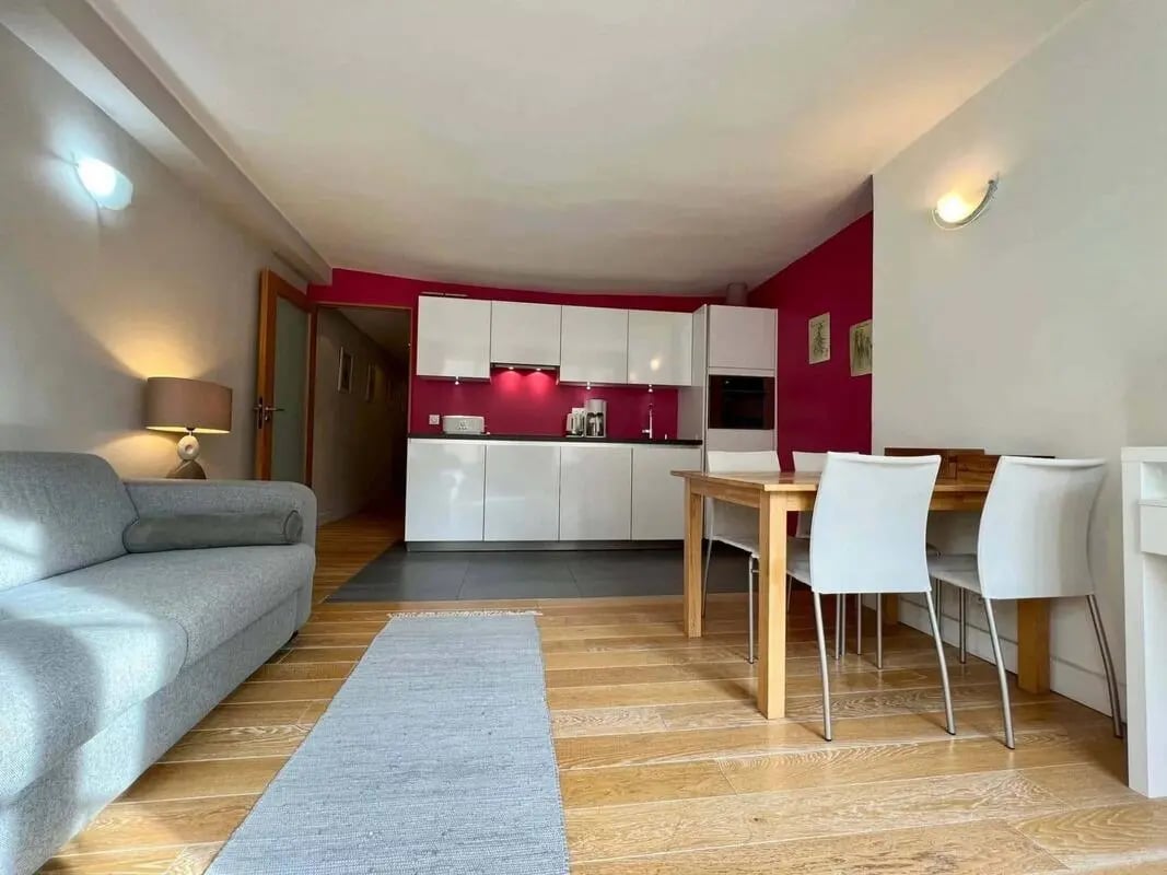 Sofa kitchen dining table and chairs living room at Apartment in 260 Rue Saint-Honoré, 75001 Paris, France in Paris Student Accommodation