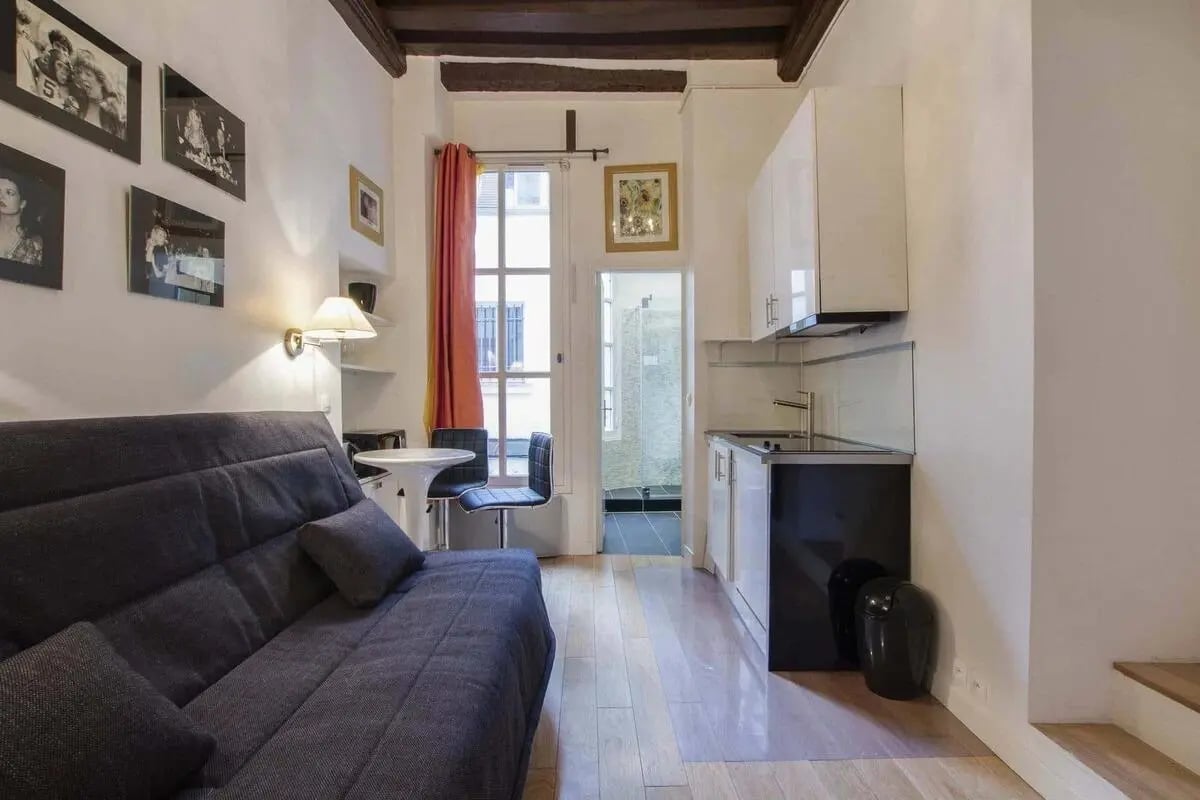 Sofa kitchen small table chairs bathroom visible studio apartment at Studio in 27 Rue de Saintonge, 75003 Paris, France in Paris Student Accommodation