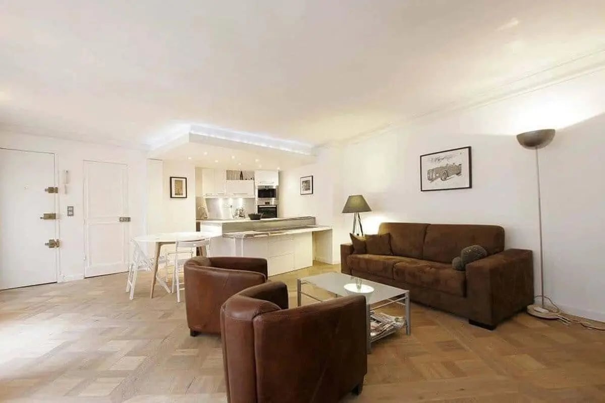 Sofa chairs table kitchen cabinets lighting living room at Apartment in 15 Rue Gaillon, 75002 Paris, France in Paris Student Accommodation