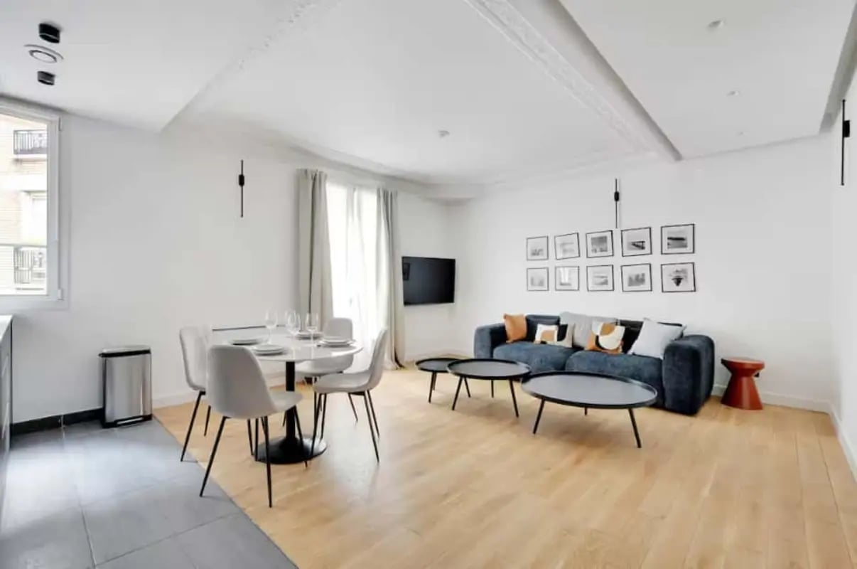 Dining area with sofa and coffee tables living room at Apartment in 50 Rue Caulaincourt, 75018 Paris, France in Paris Student Accommodation