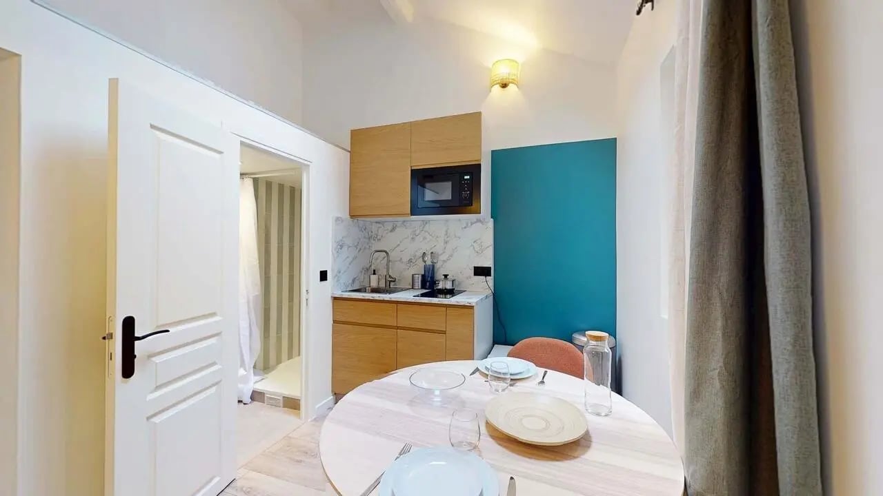 Kitchen dining table with sink and microwave kitchen at Studio in 10 Rue des Dames, 75017 Paris, France in Paris Student Accommodation