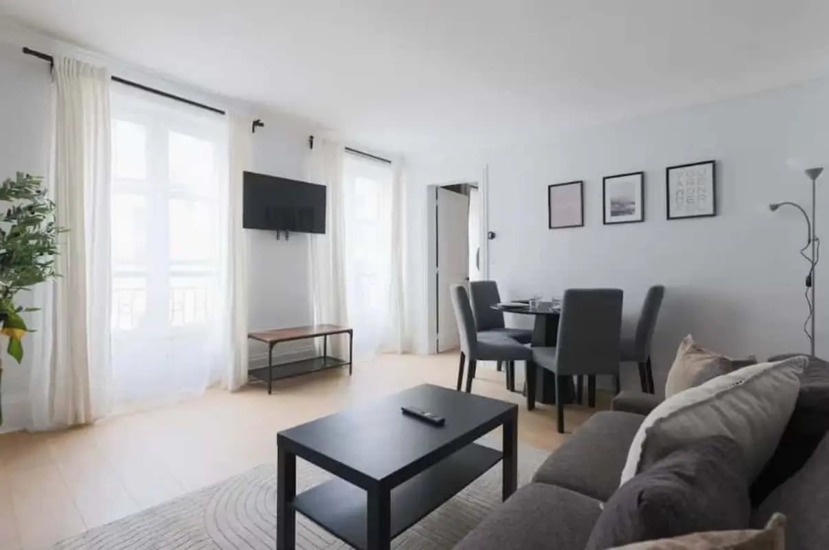 Sofa coffee table dining set television living room at Apartment in 80 Rue du Bac, 75007 Paris, France in Paris Student Accommodation
