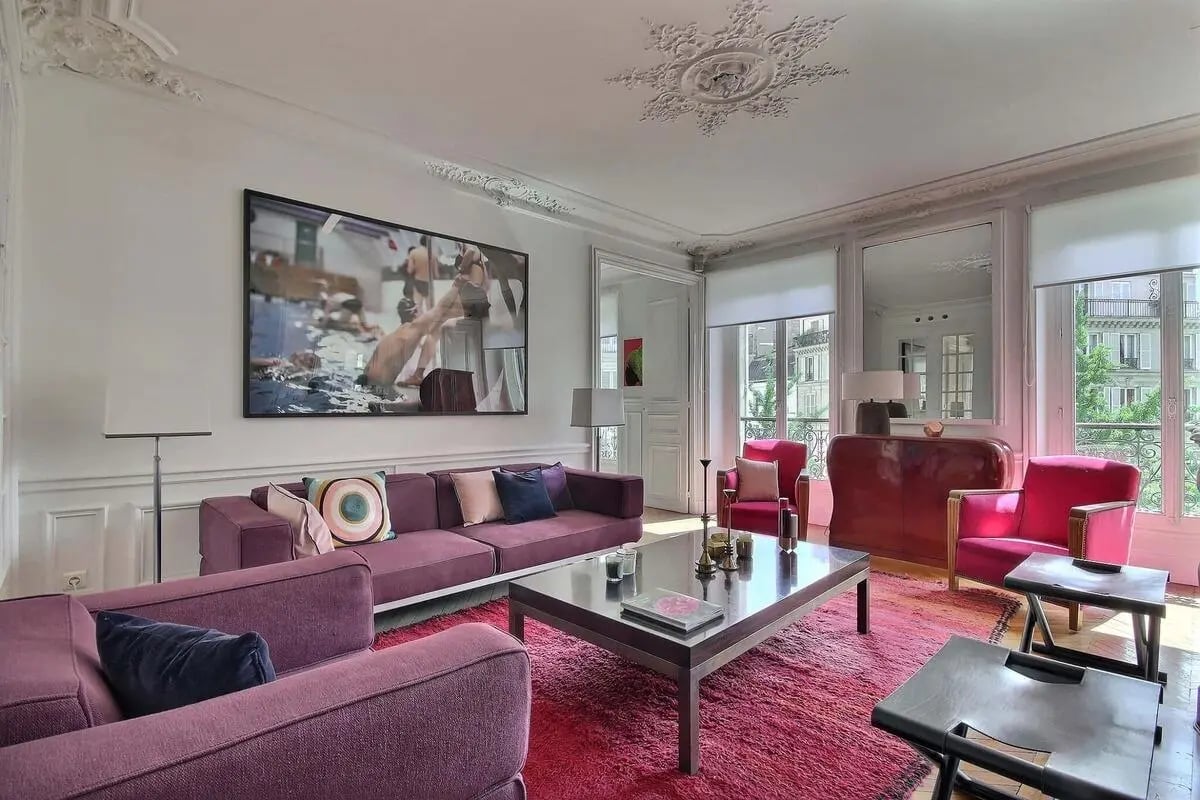 Purple sofas coffee table artwork living room at Apartment in Rue de Saint-Pétersbourg, 75008 Paris, France in Paris Student Accommodation