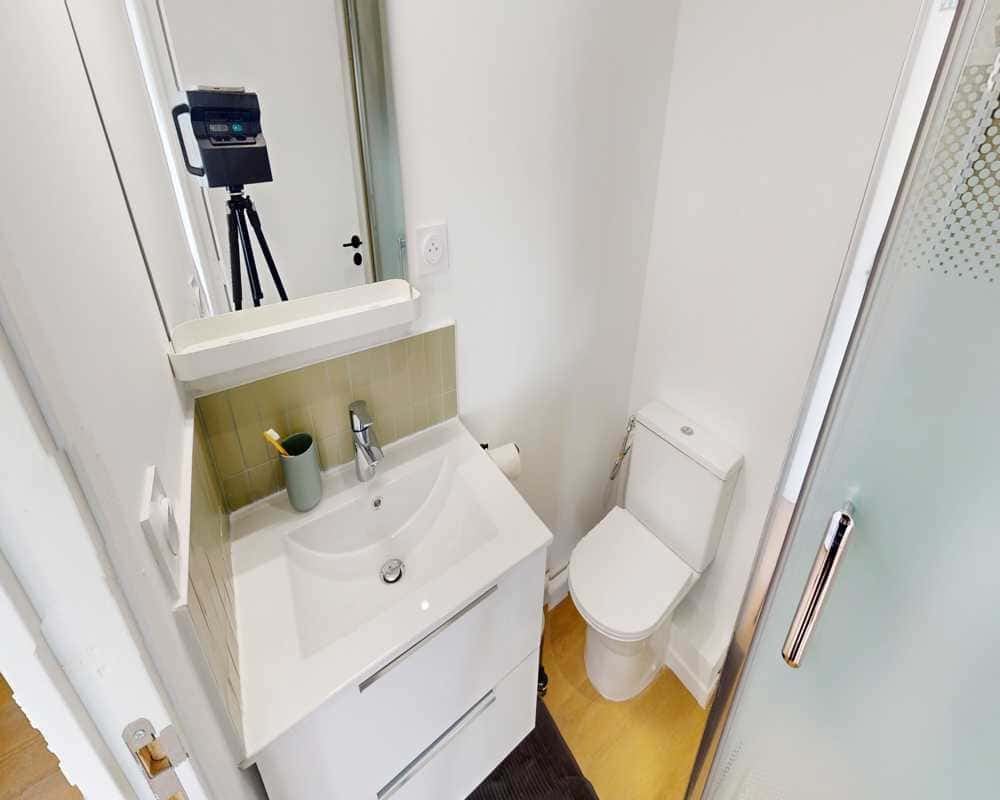 Sink toilet shower cabin bathroom at Room in 22 Bd Poissonnière, 75009 Paris, France in Paris Student Accommodation
