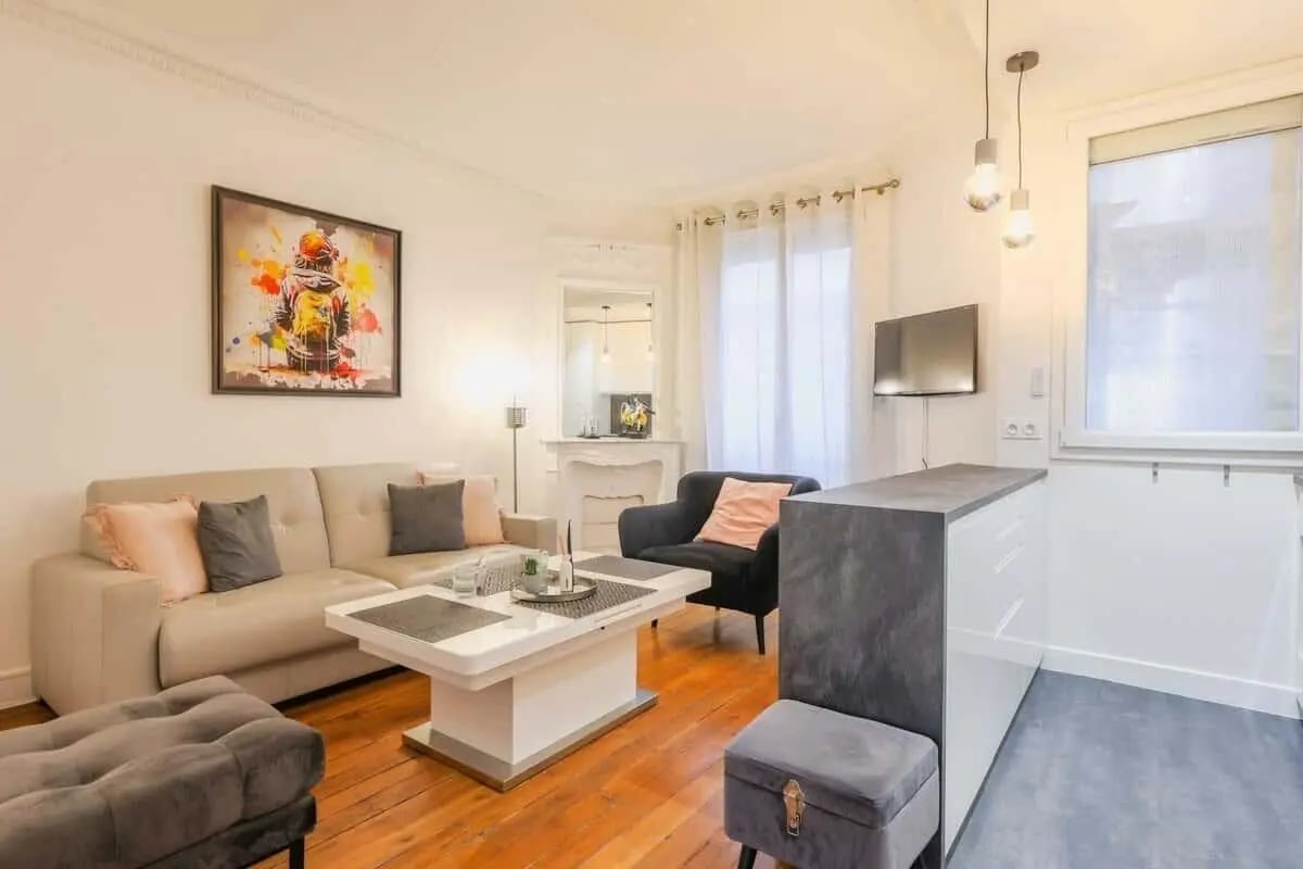 Sofa armchair coffee table modern kitchen living room at Apartment in 6 Rue Fourcade, 75015 Paris, France in Paris Student Accommodation
