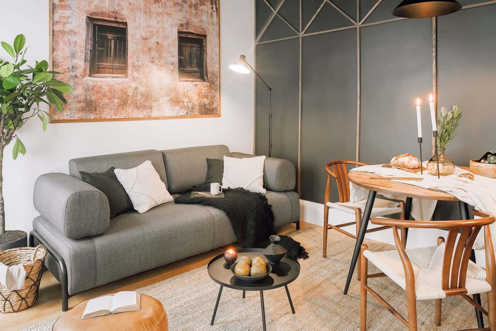 Gray sofa with pillows dining table living room at Apartment in 58 Rue de Babylone, 75007 Paris, France in Paris Student Accommodation