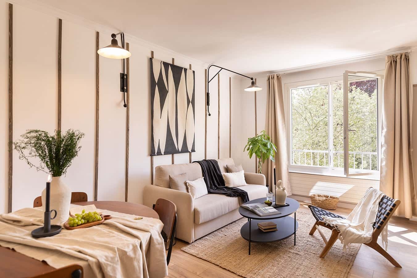 Sofa coffee table chairs artwork living room at Apartment in 13 Bd des Invalides, 75007 Paris, France in Paris Student Accommodation