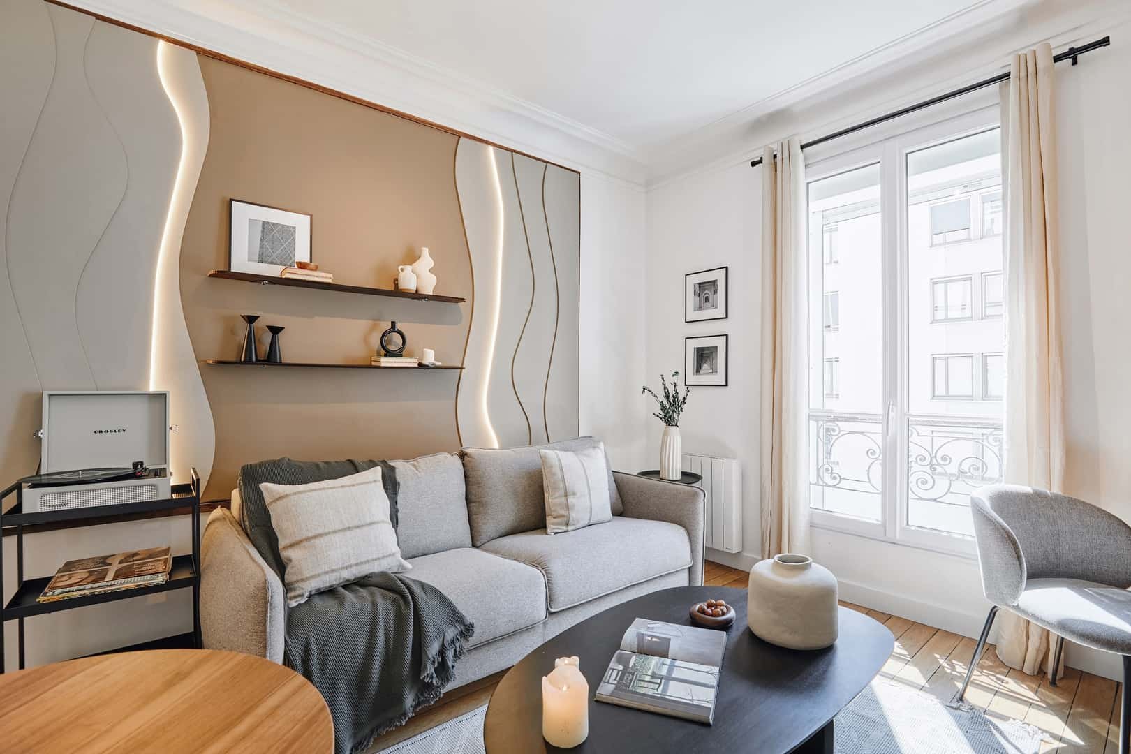 Sofa shelves record player and coffee table living room at Apartment in 13 Rue Robert Fleury, 75015 Paris, France in Paris Student Accommodation