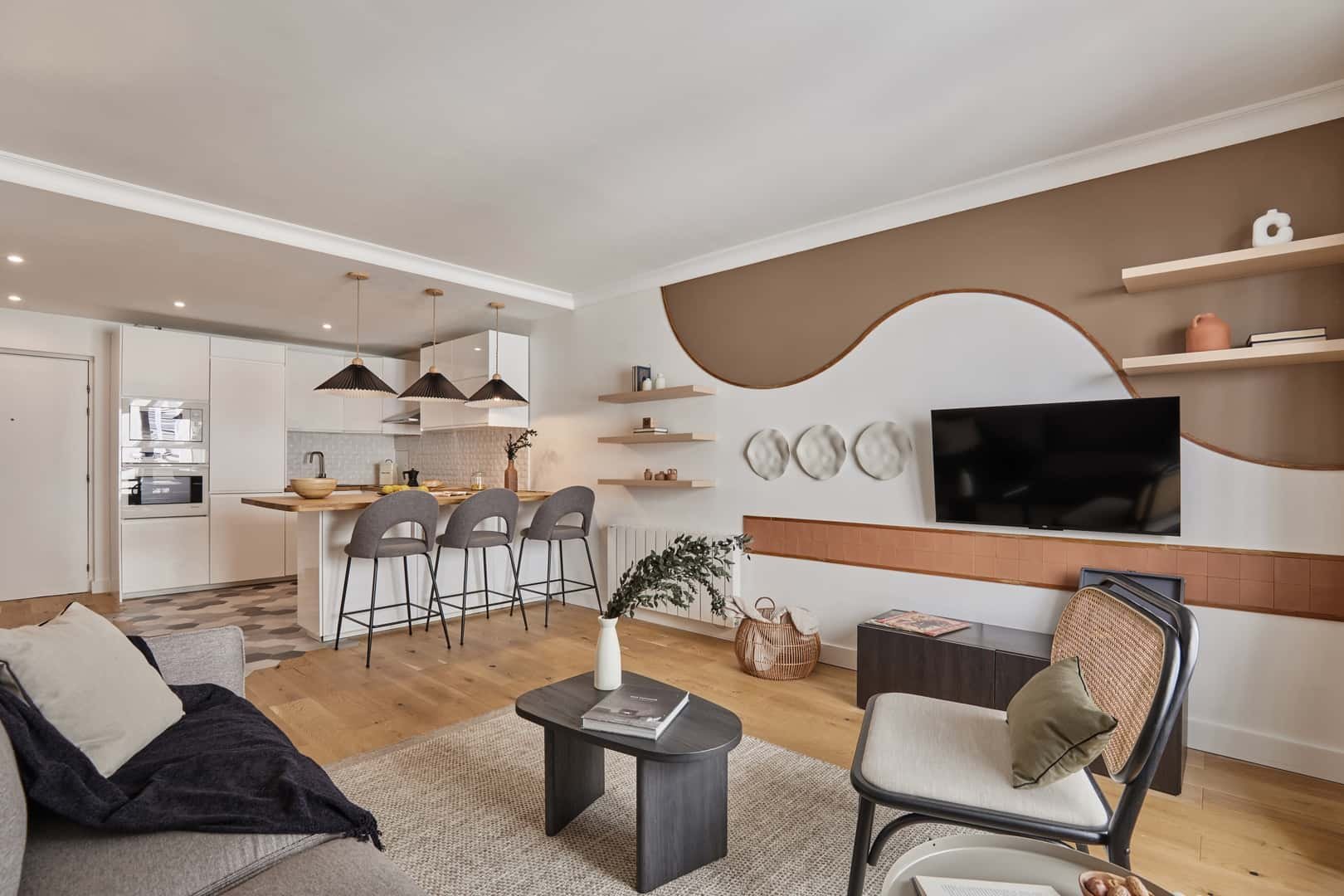Modern kitchen with bar seating and living room living room at Apartment in 7 Rue Lebouteux, 75017 Paris, France in Paris Student Accommodation