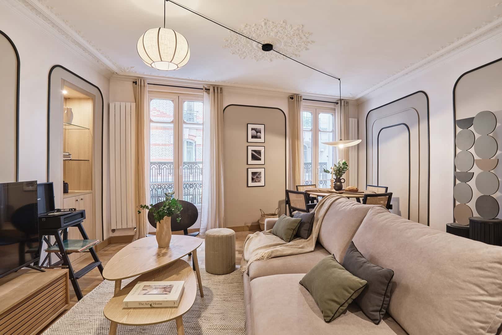 Sofa dining table coffee table and TV living room at Apartment in 19 Rue Commines, 75003 Paris, France in Paris Student Accommodation