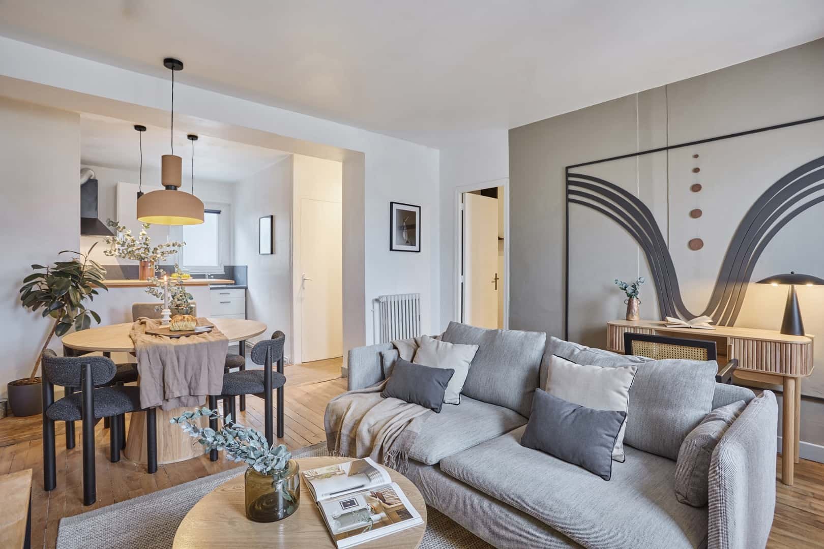 Sofa dining table and kitchen living room at Apartment in 50 Rue Violet, 75015 Paris, France in Paris Student Accommodation